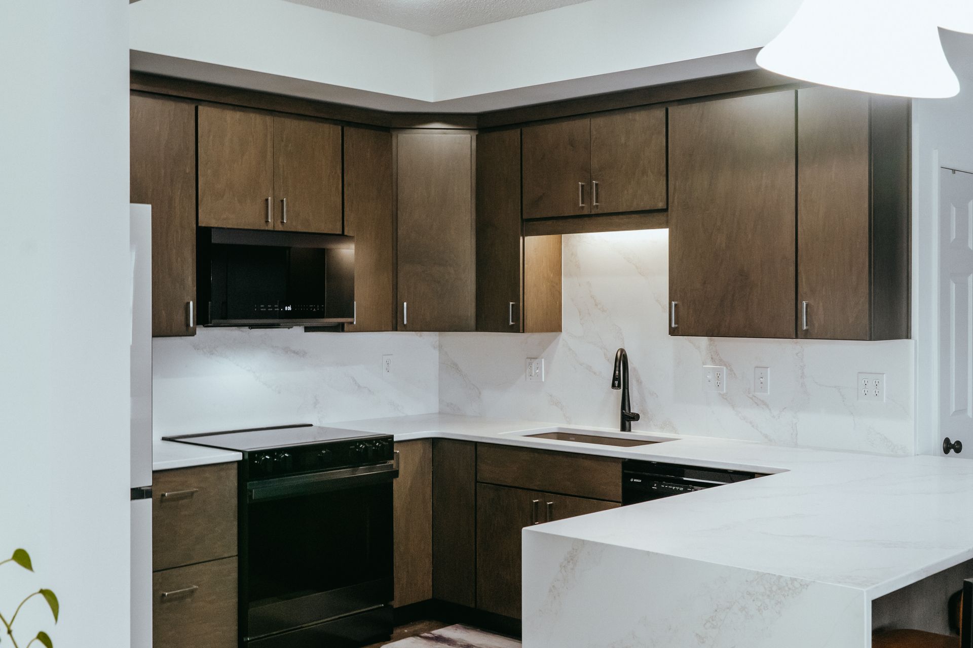 Balanced white quatz counters and stylish wood cabinets