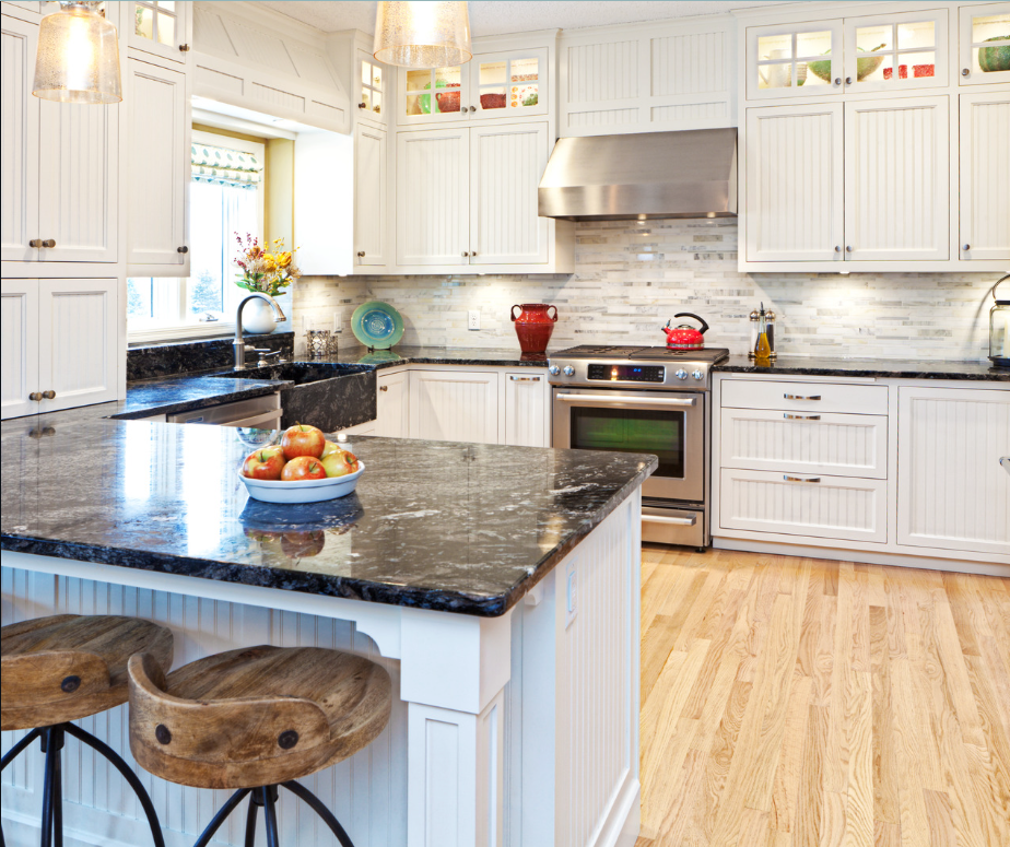 modern kitchen image with dark quartz countertop and whit cabinets