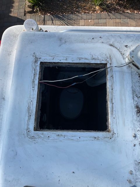 A white roof with a hole in the middle of it.