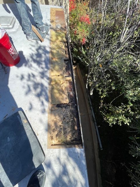 A red cooler with the word coca cola on it