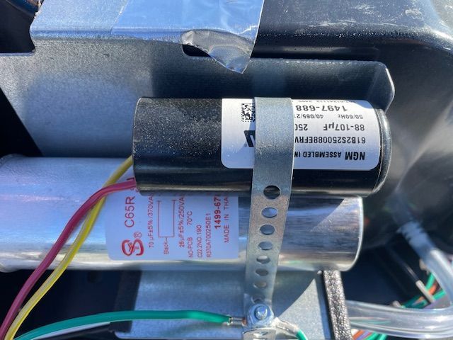A close up of a capacitor with a label that says ' nsm ' on it