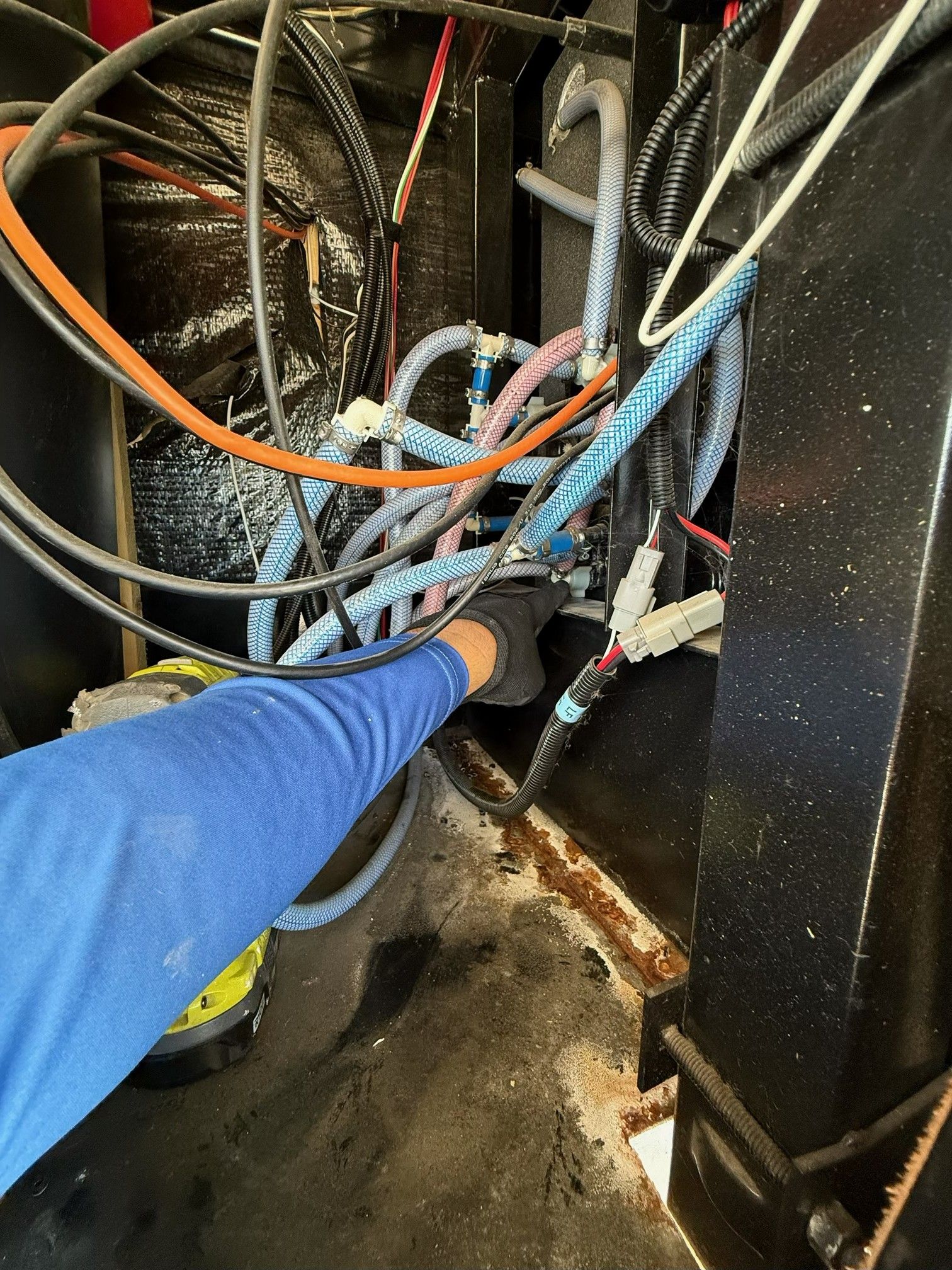 RV furnace unit inside a compartment, showing electrical wiring and air ducts.