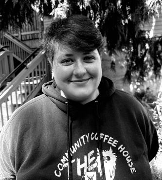 Sarah Henry is smiling in a black and white photo, resource navigator at OWL360