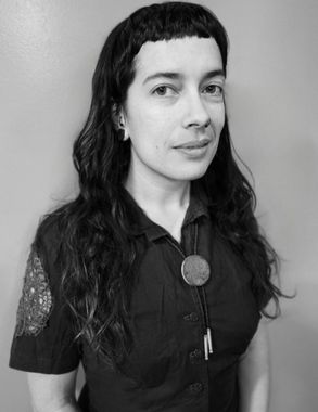 Jessica Garcia, mental health providers, is smiling in a black and white photo .