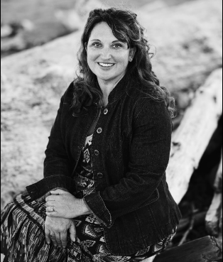 Nicole O'Hara smiling in a black and white photo , operations manager at OWL360