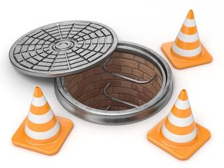 Open manhole and traffic cones — Septic Systems in Omaha, NE