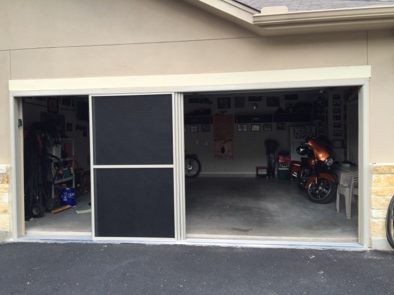 A garage with a motorcycle parked inside of it