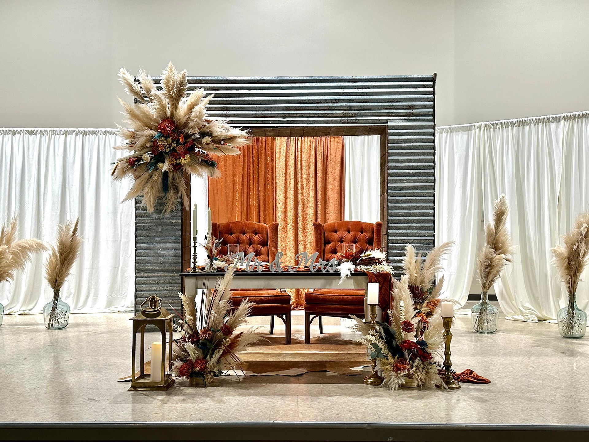 There is a table and chairs in the middle of the room.