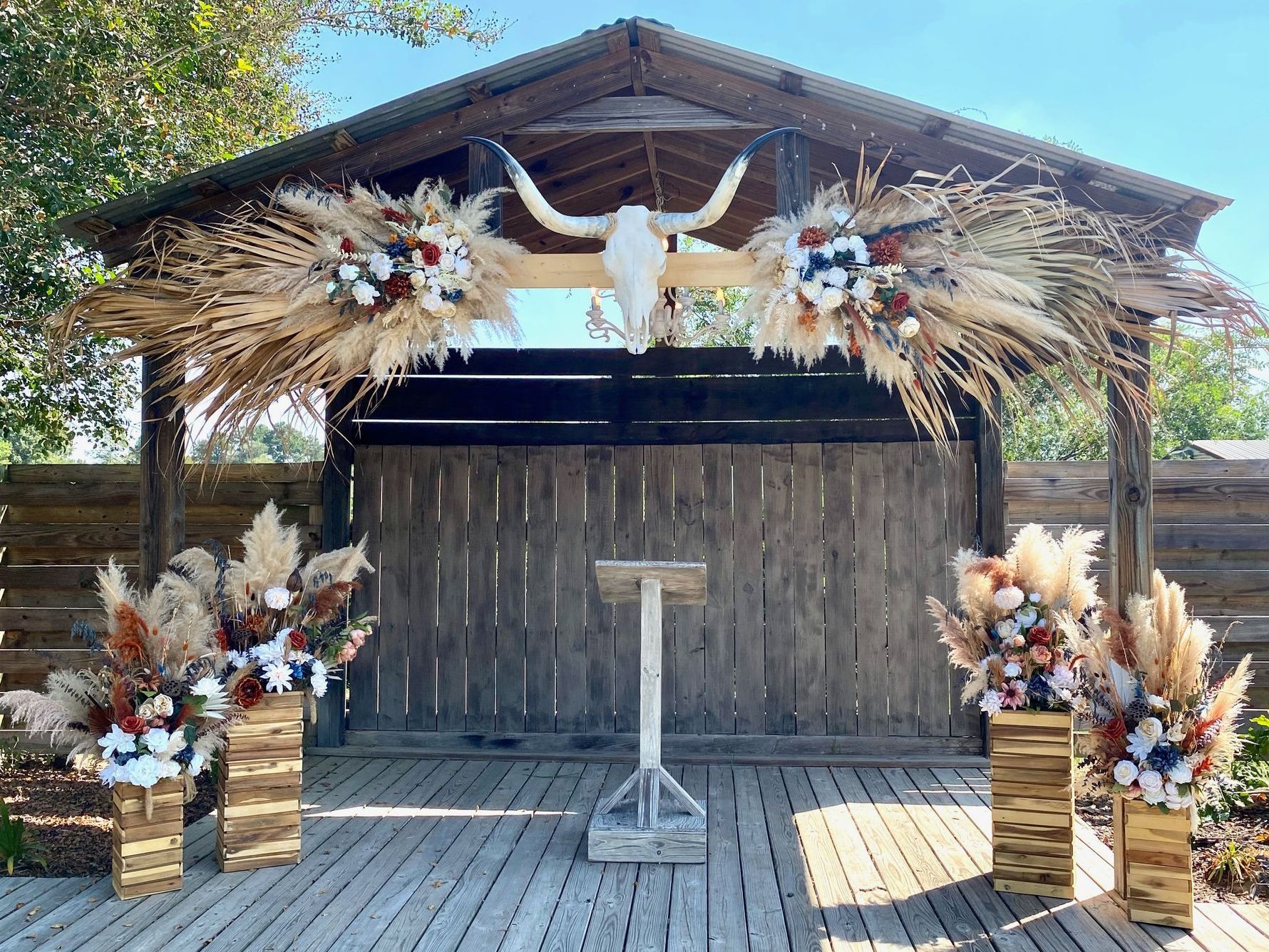 A wooden structure with a podium and a skull on top of it.