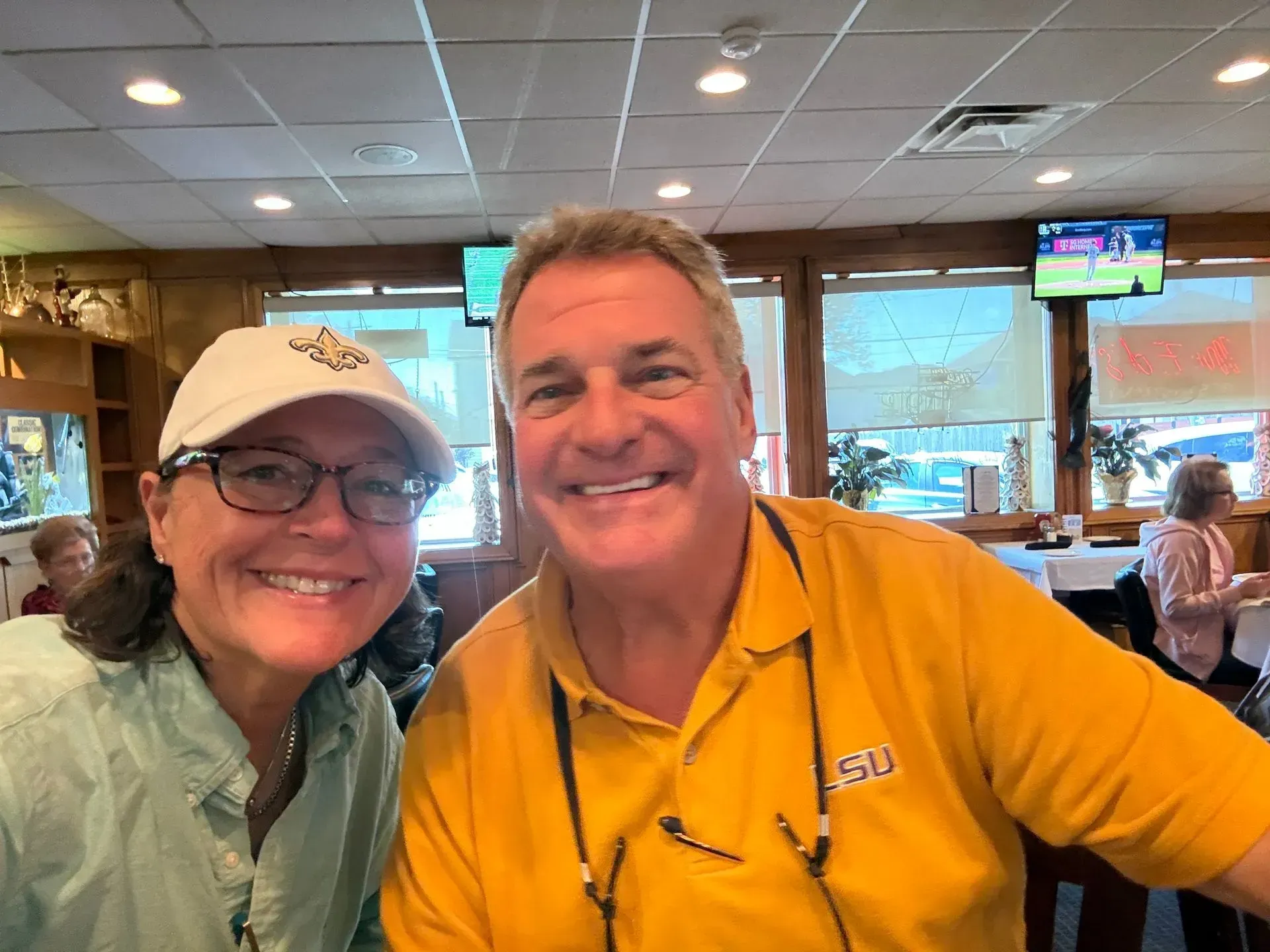 Divorce mediation: hands gesturing, judge's gavel on wedding ring, seated at table with documents.