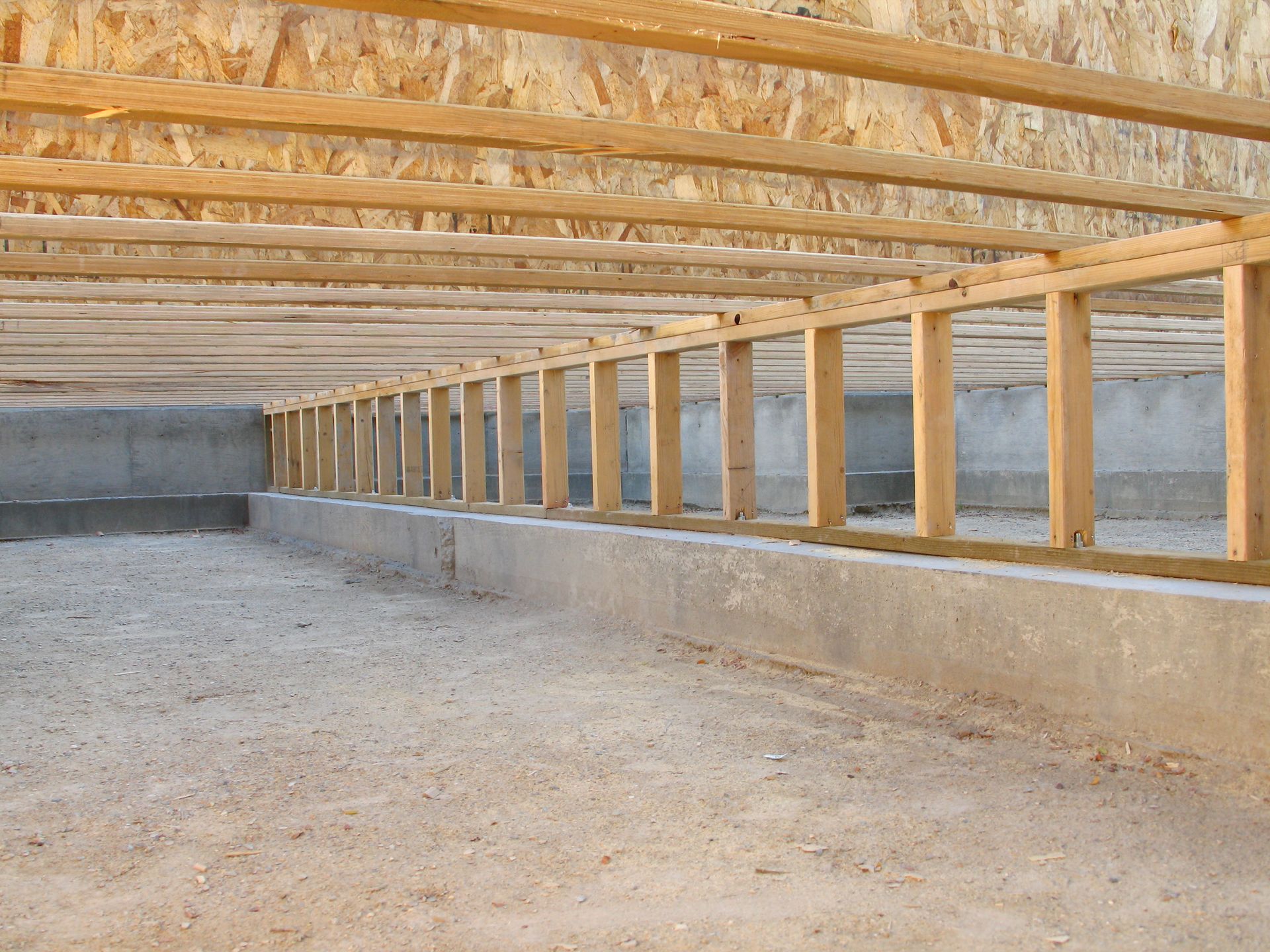 Construction Site: Neat Clean Crawlspace, Floor Joists, and Pony Wall