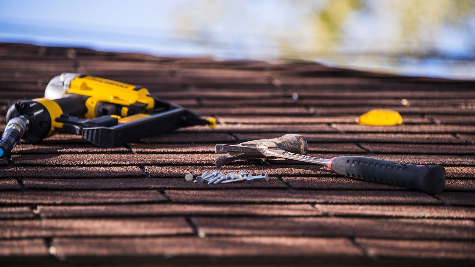 asphalt shingle roof repair with power tool