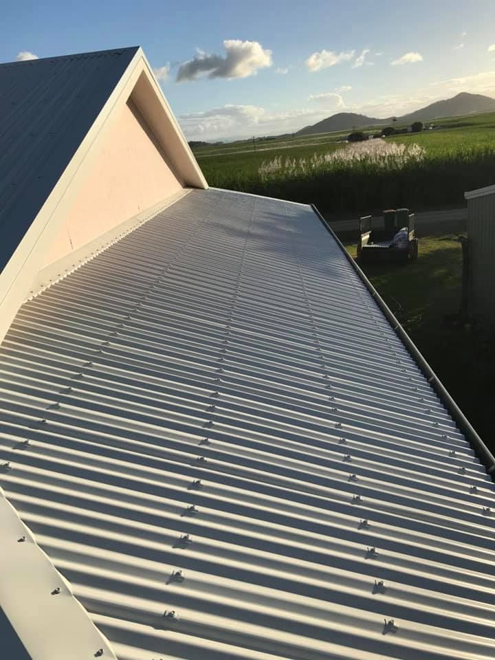 A Close Up of a Roof With a Blue Sky in the Background — Bradshaw Plumbing & Roofing Pty Ltd In East Mackay, QLD