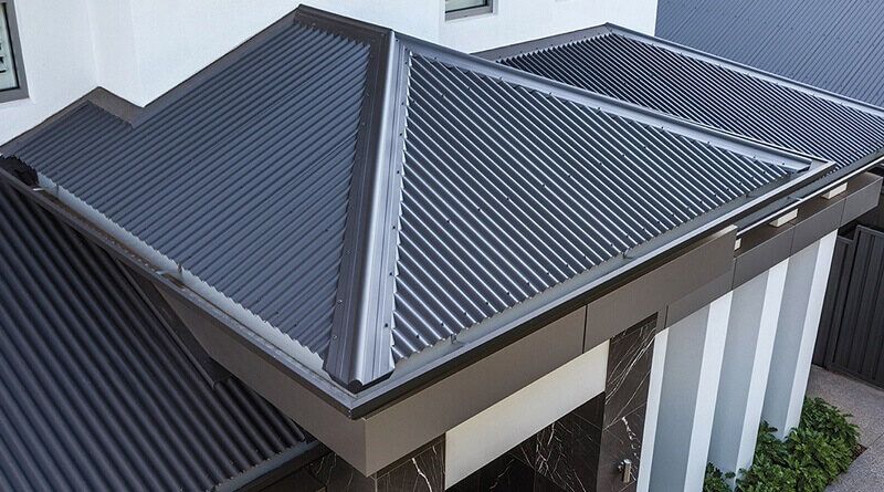 An Aerial View of a House With a Corrugated Metal Roof — Bradshaw Plumbing & Roofing Pty Ltd In Marian, QLD An Aerial View of a House With a Corrugated Metal Roof — Bradshaw Plumbing & Roofing Pty Ltd In Marian, QLD