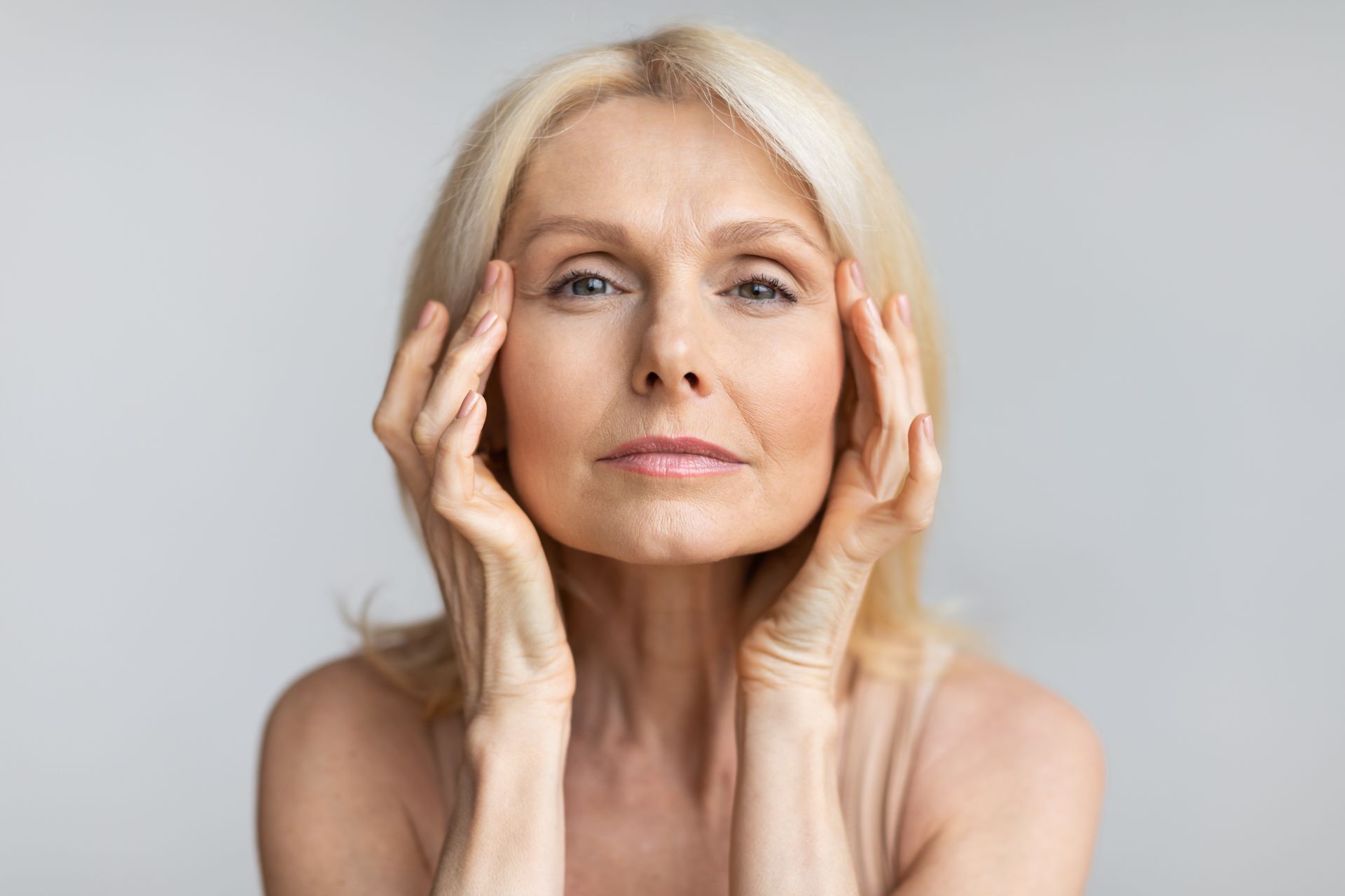 middle aged woman looking in camera