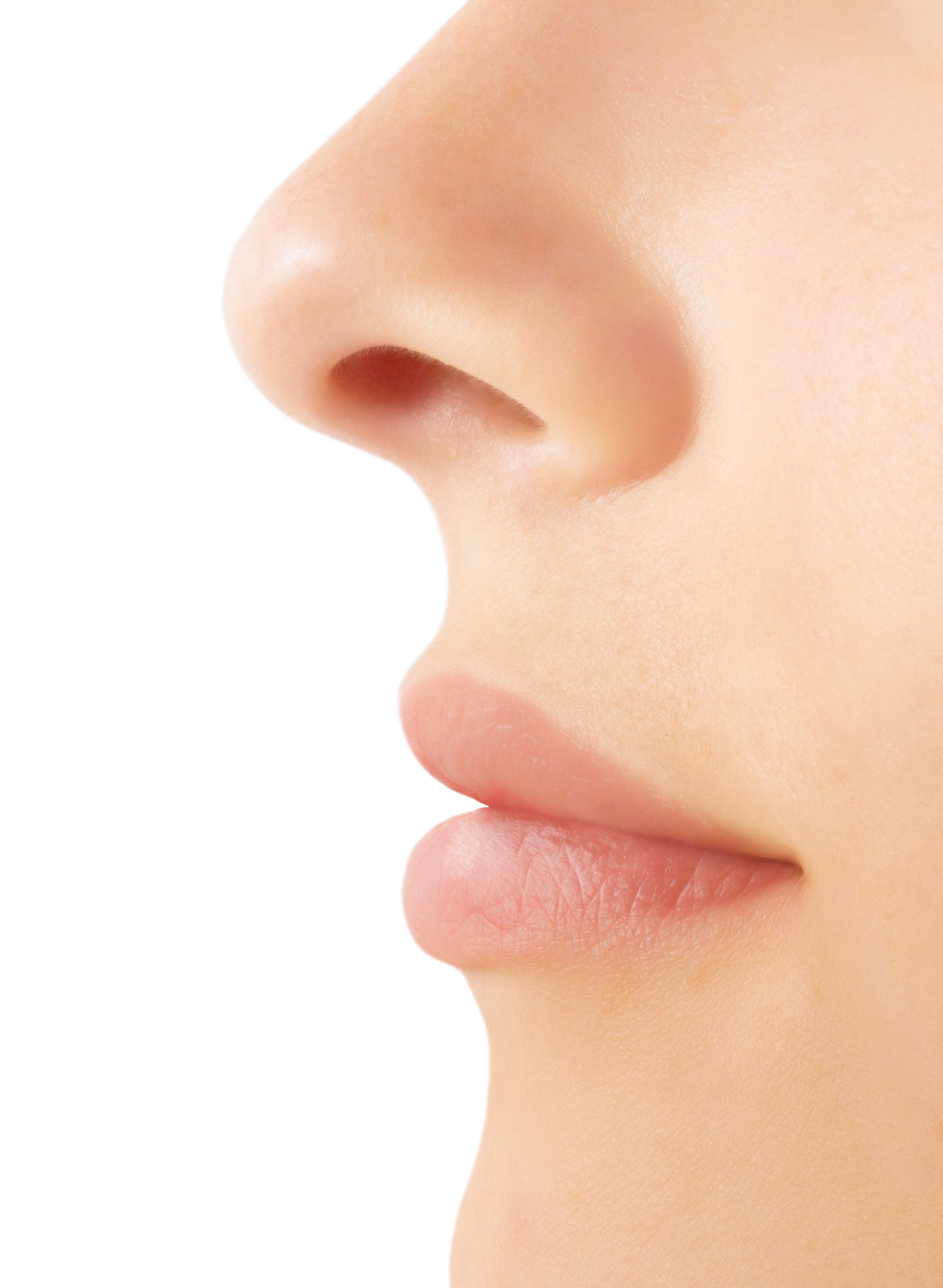 a close up of a woman 's nose and lips on a white background .