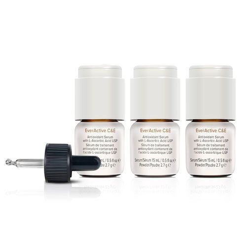 Three bottles of serum with a dropper on a white surface.