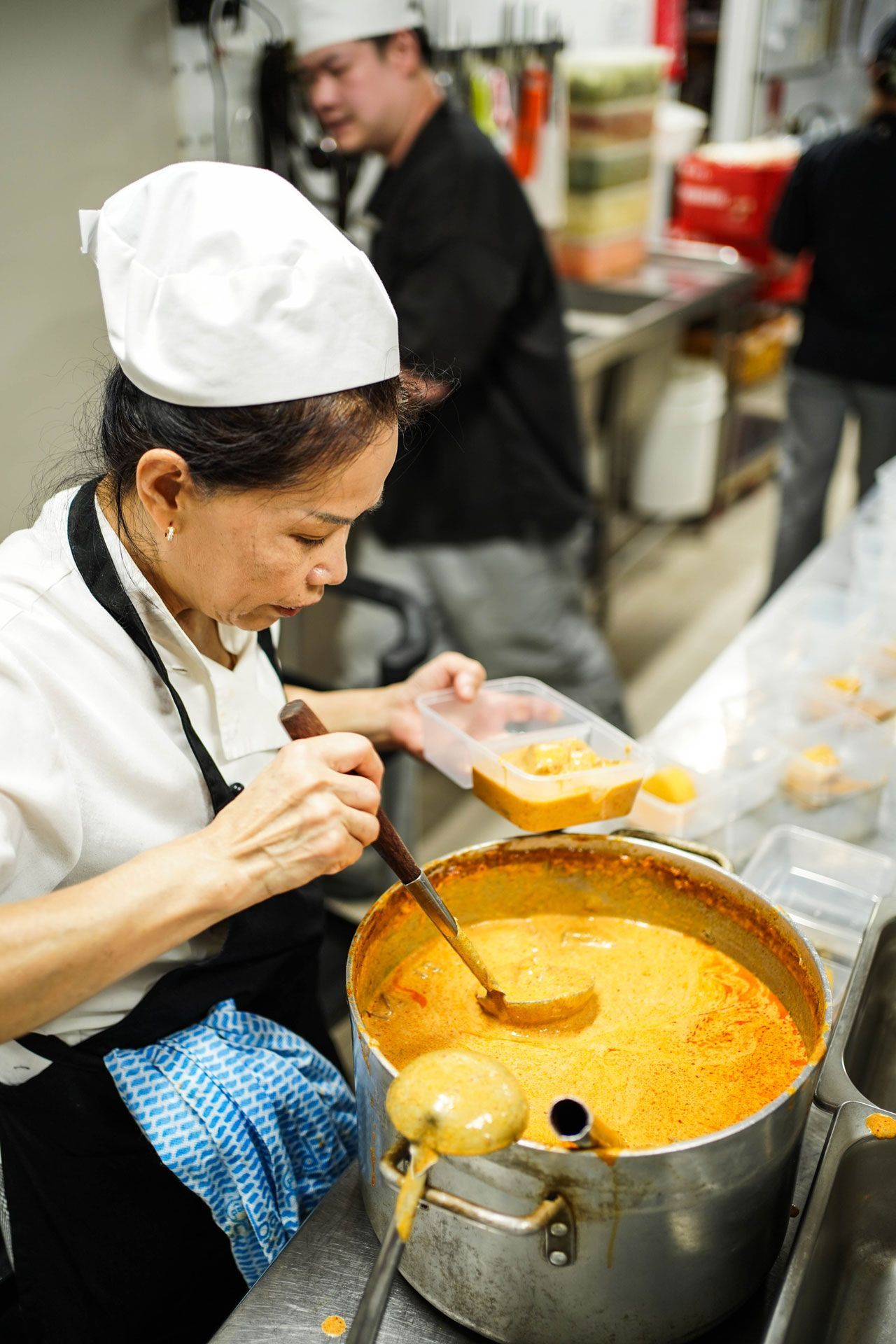Thai Pothong chef is preparing Thai Curry for Lunch Box delivery