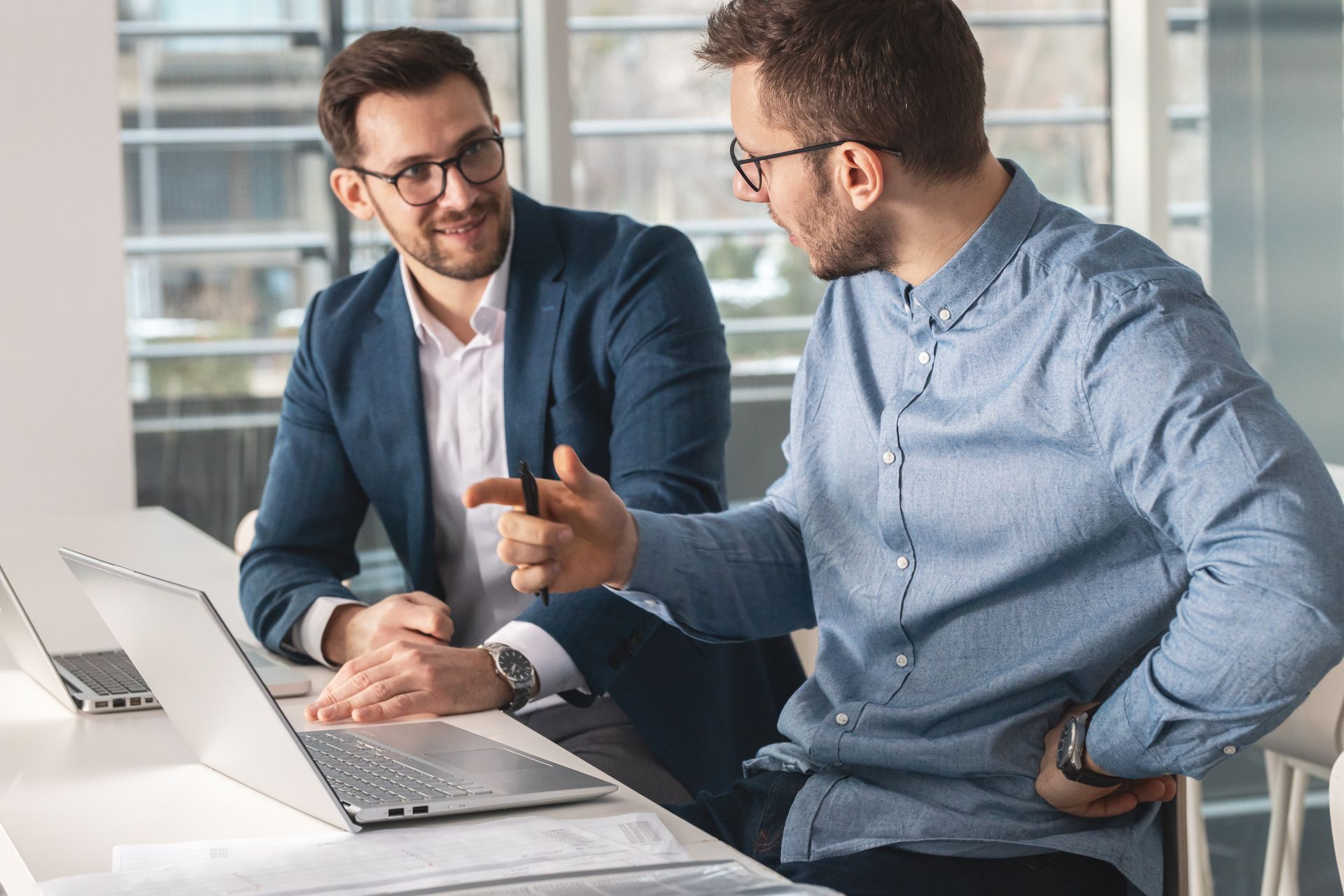 A lake in the middle of a forest with trees in the background