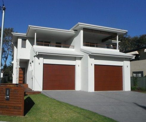 A House with a Blue Garage Door | Killarney Vale , NSW | BJP Plastering