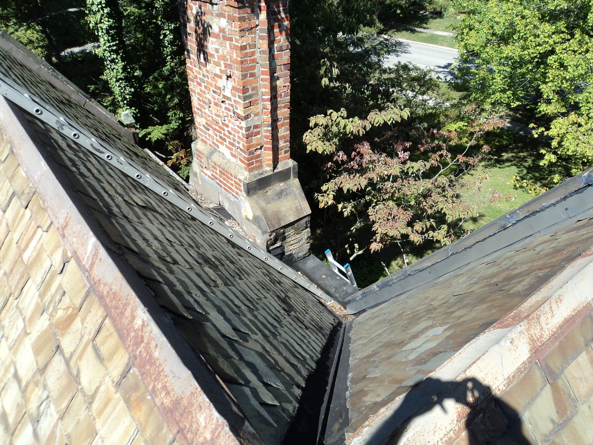 Before: Replace Valley, Chimney Saddle, and Parapet Wall Flashing