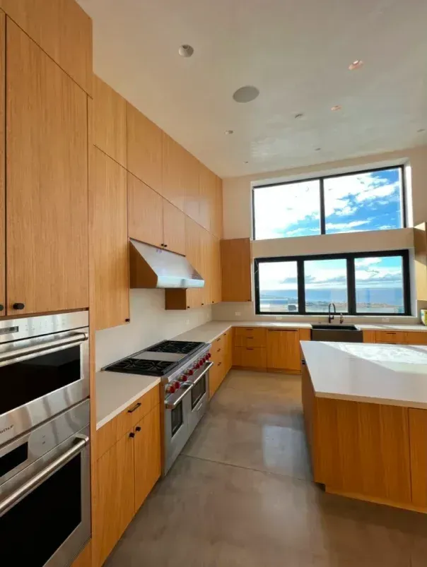 A kitchen with stainless steel appliances and wooden cabinets