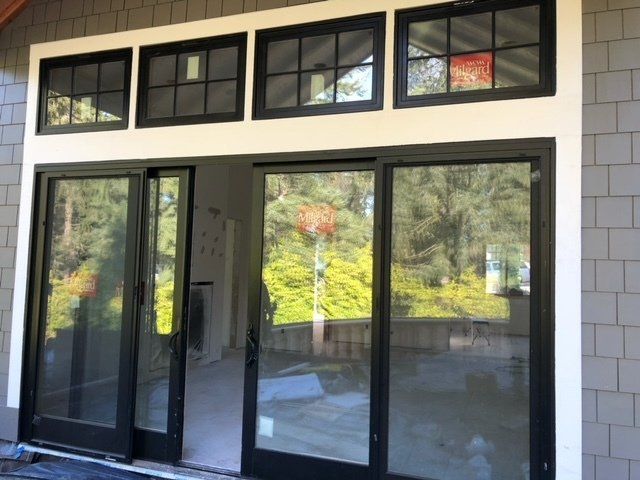 A house with a lot of windows and sliding glass doors — Tukwila, WA — Bel-Red Windows & Doors