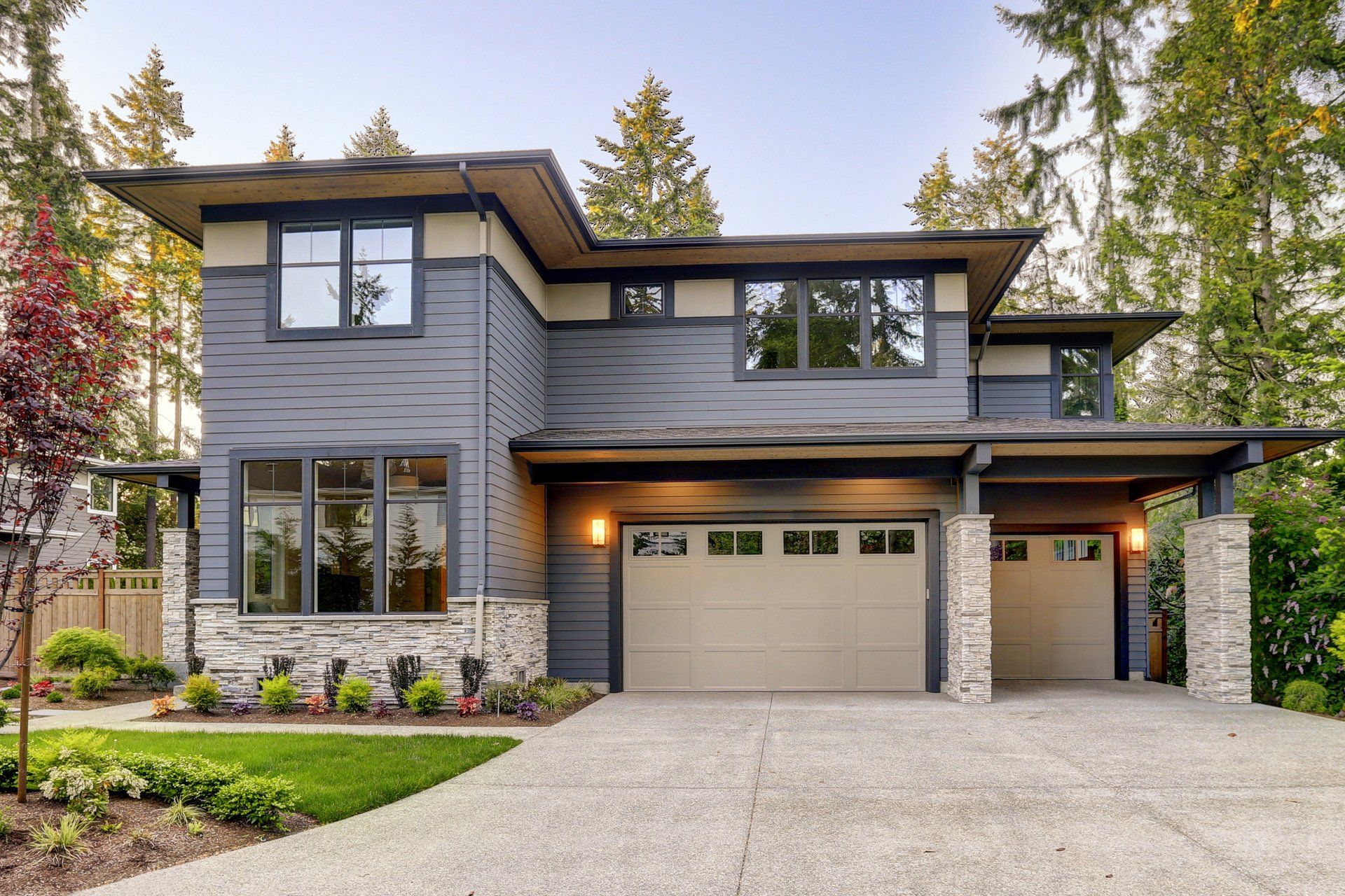 A large house with a garage and a lot of windows — Tukwila, WA — Bel-Red Windows & Doors