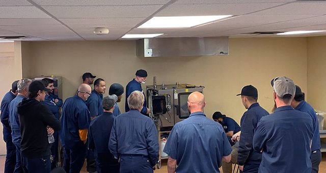 Two Man Installing Refrigerator — Commercial Refrigerator Repairs in Colorado Springs, CO