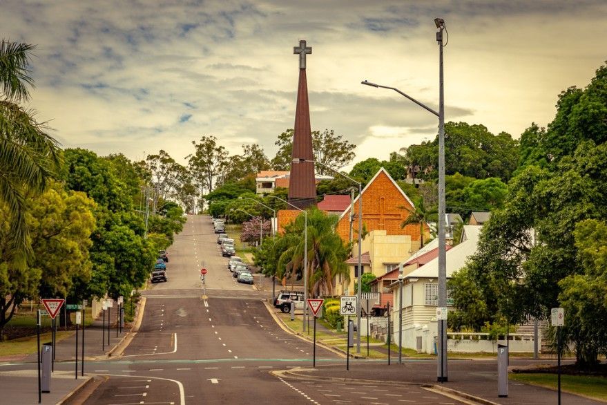 Street View of a Town With a Tall Church Steeple Topped — Hannant Plant Hire in Ipswich, QLD