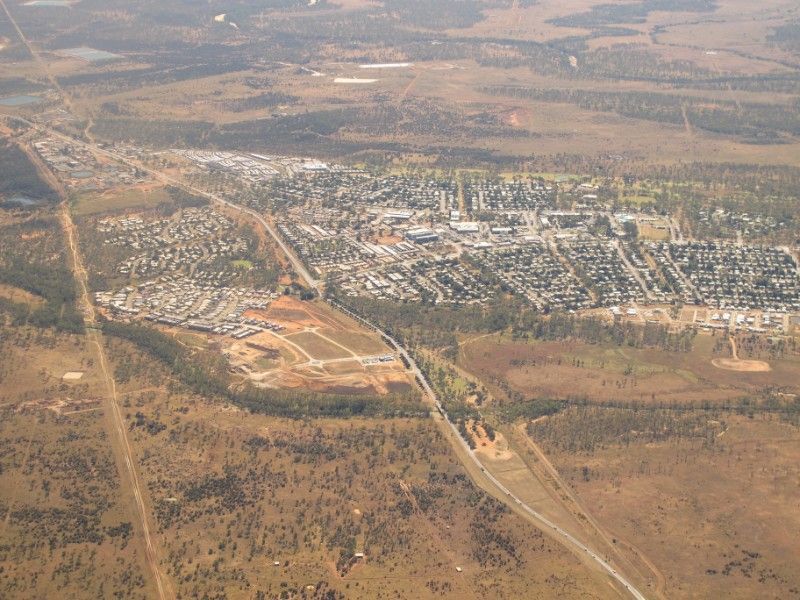 Aerial View of a Town With Buildings and Trees — Hannant Plant Hire in Moranbah, QLD