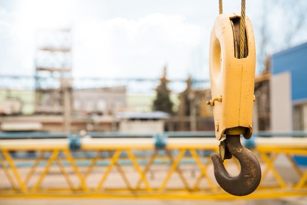 Close Up of a Crane Hook Hanging From a Rope — Hannant Plant Hire in Robina, QLD