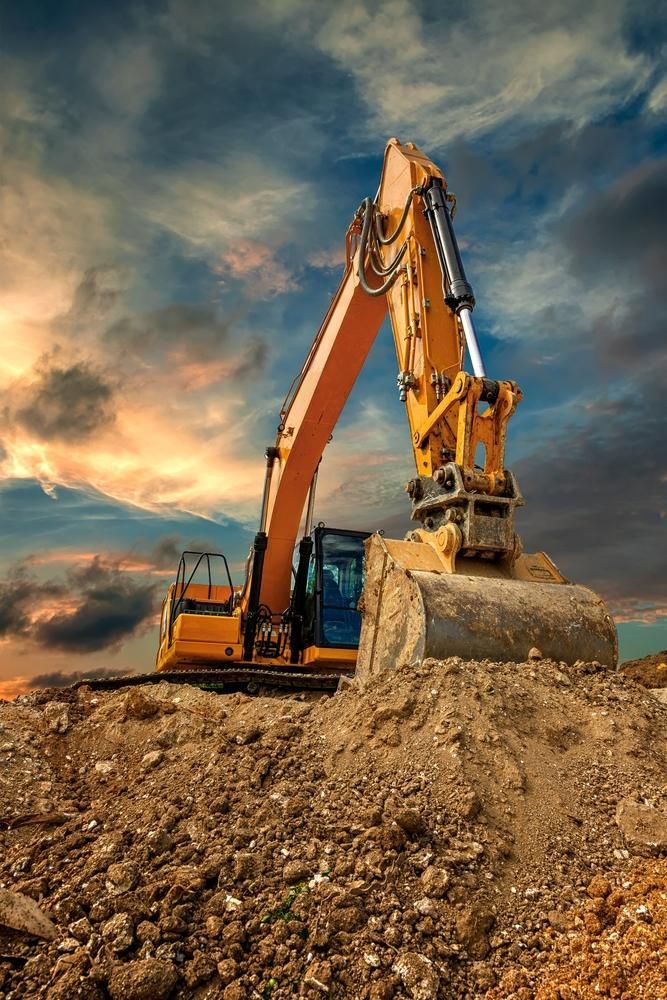 Yellow Excavator is Digging a Pile of Dirt on a Construction Site — Hannant Plant Hire in Robina, QLD