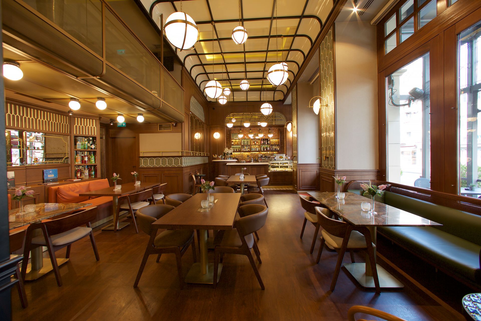 A restaurant with tables and chairs and a large window