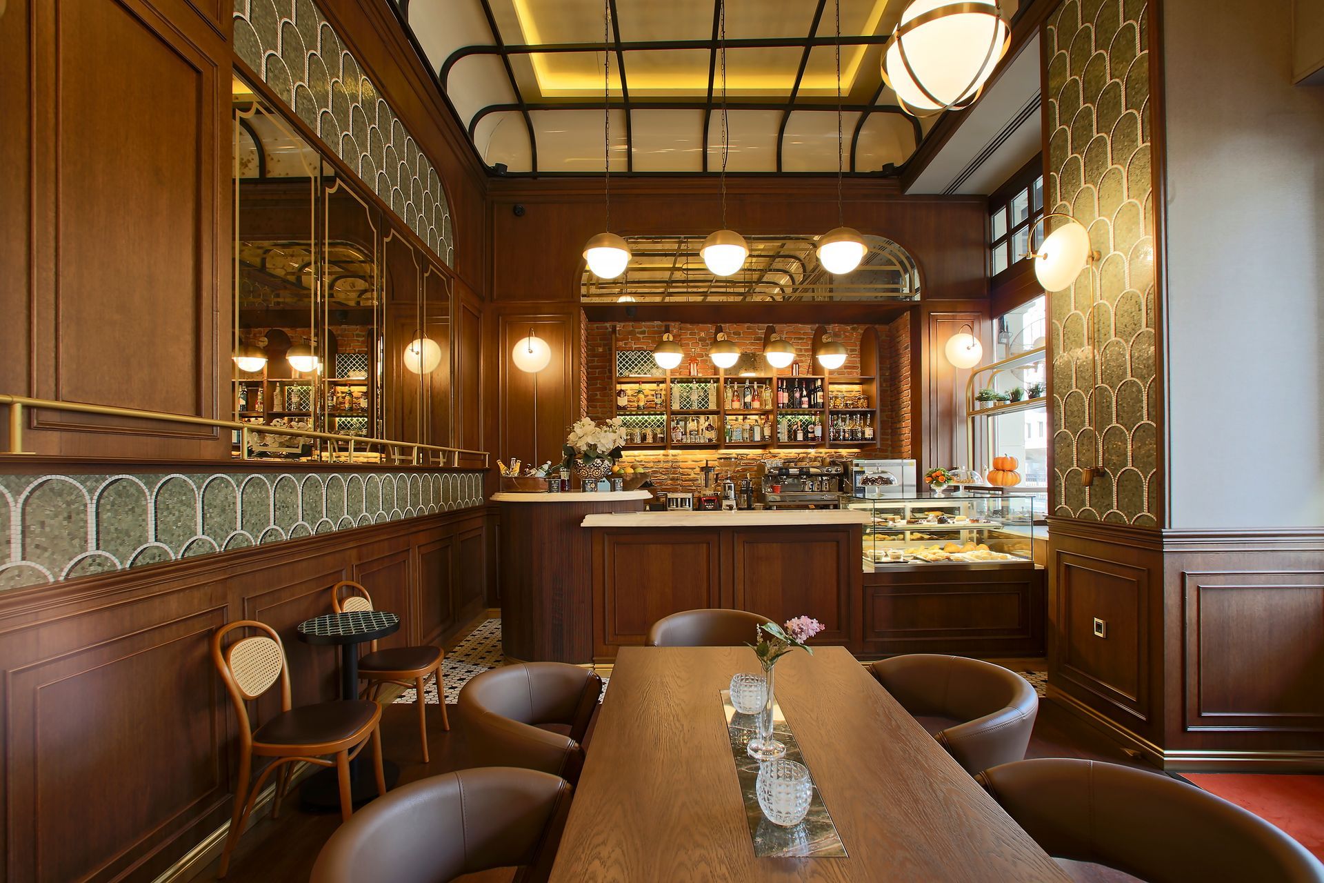 A restaurant with a table and chairs and a bar