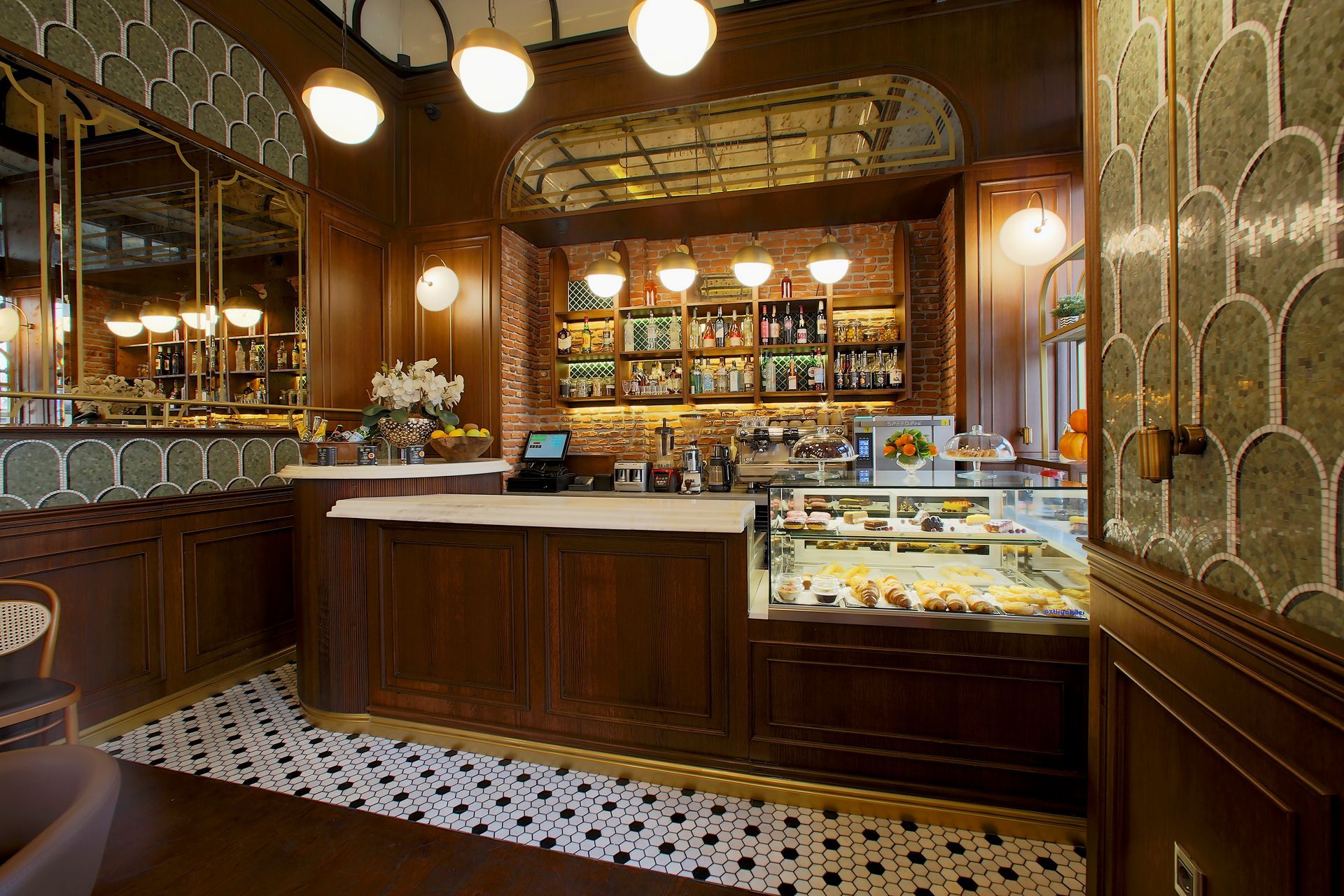 A restaurant with a counter and a display case