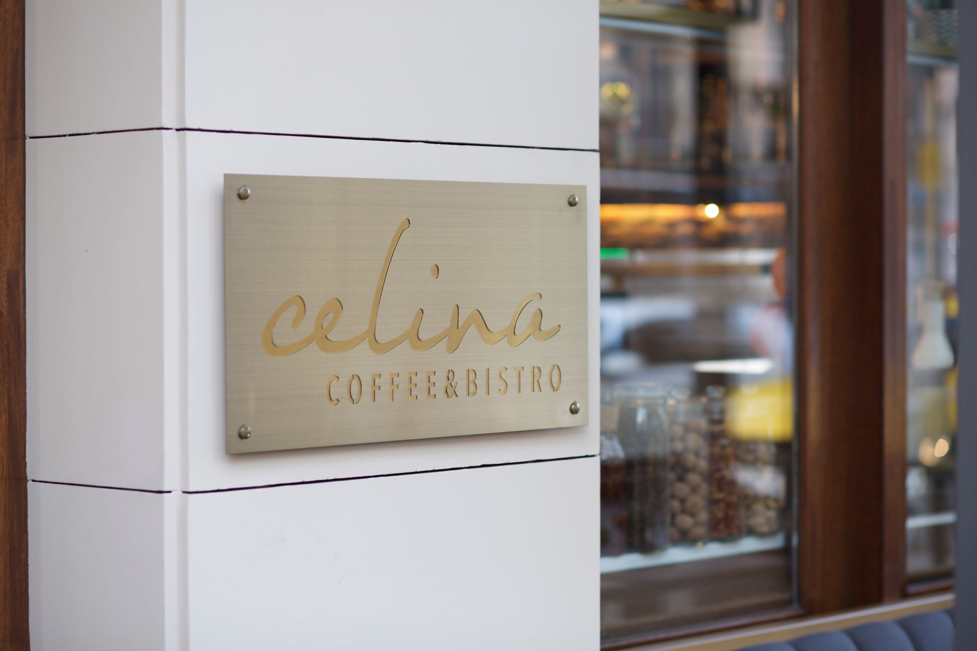 A sign on the side of a building that says ' celina coffee & bistro '