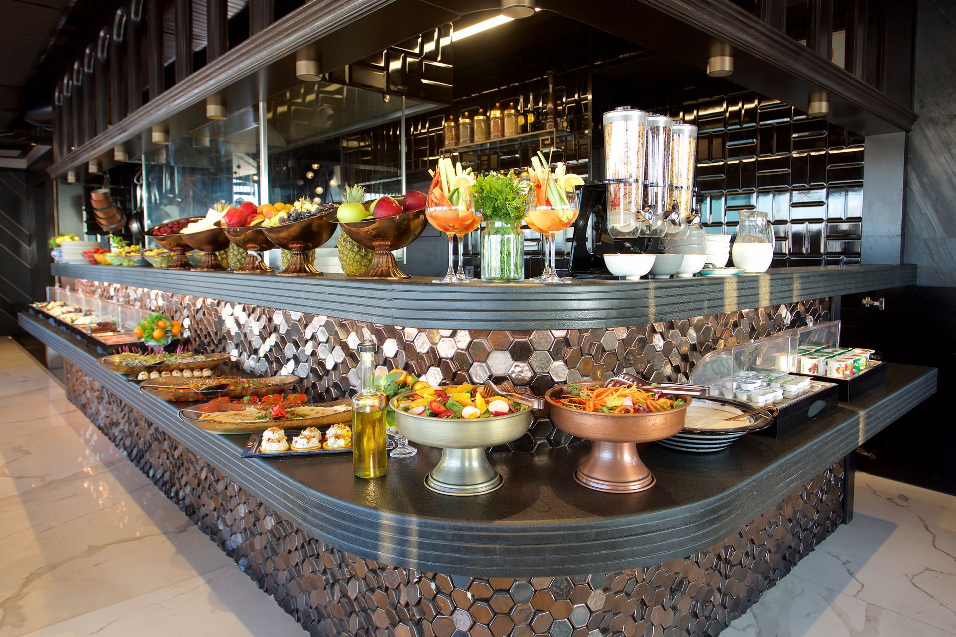 A buffet with a lot of food on it in a restaurant.