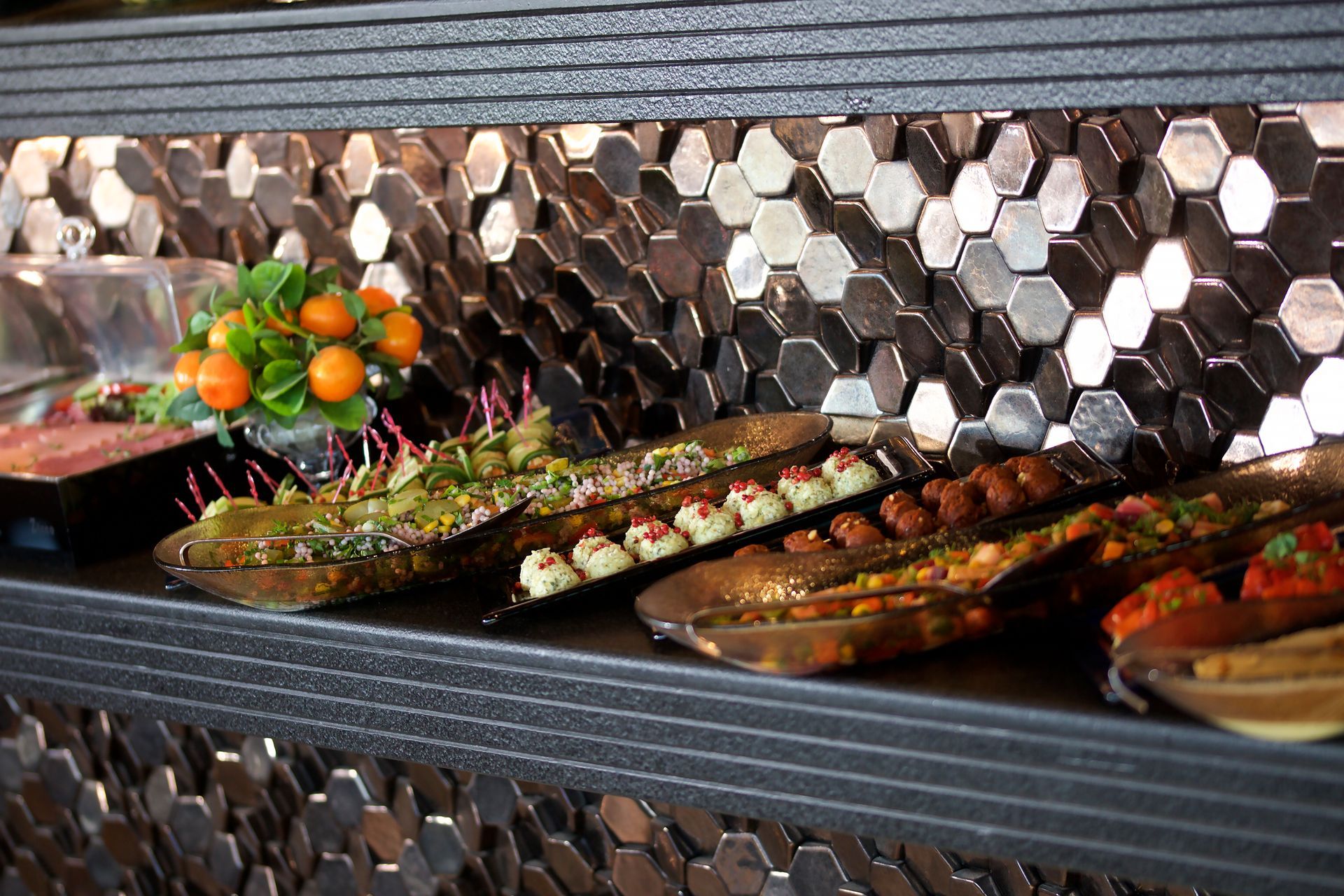 A buffet table with a variety of food on it