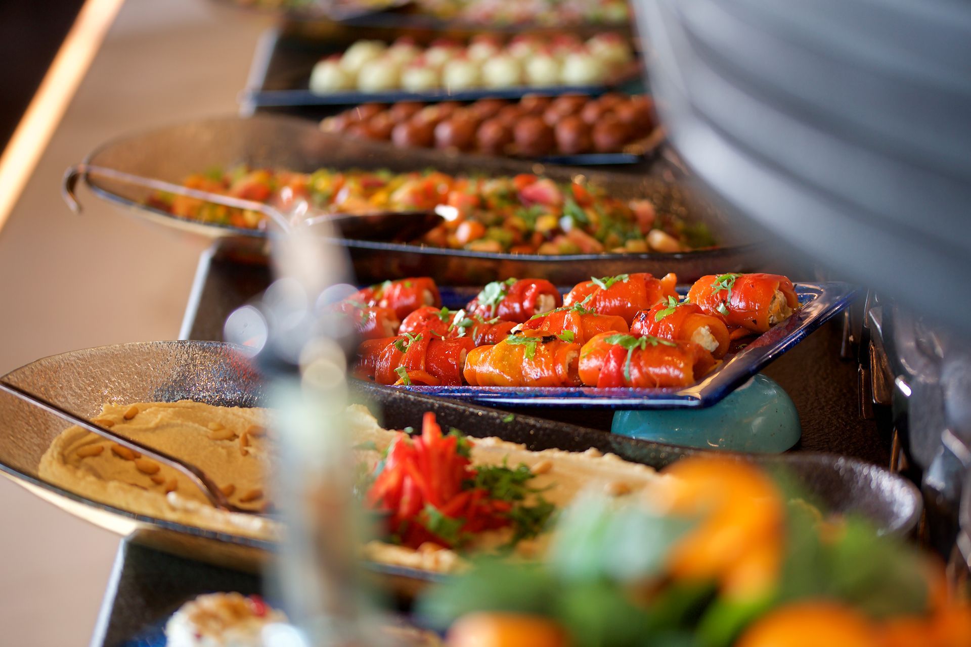 A buffet line filled with lots of different types of food.