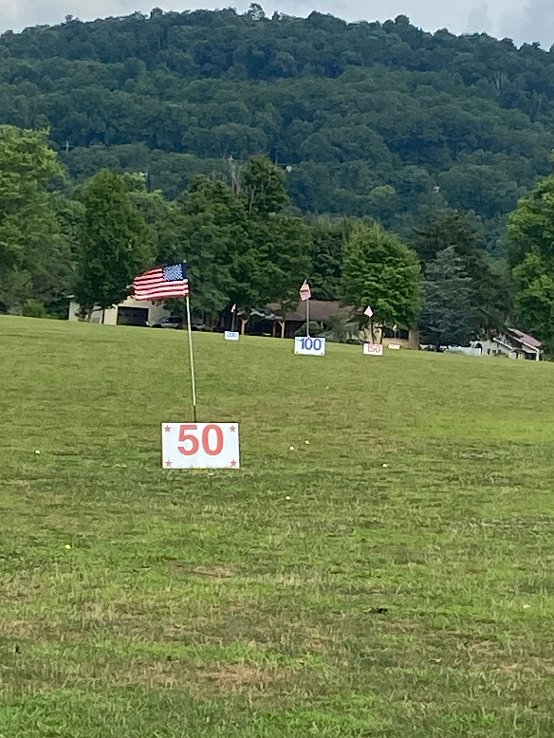 A field with a sign that says 50 on it.