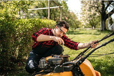 Man Repairs the Lawn Mower — Loganville, GA — Stephens Repair Shop