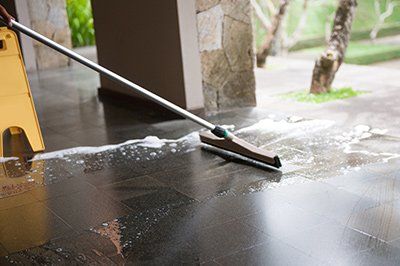 Cleaning stone surface before applying a stone sealer.