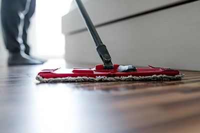 Buffing a stone sealer into the floor surface.