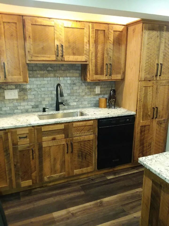 Installing Kitchen Cabinet — Pleasureville, KY — Schrock's Country Kitchens & Furniture