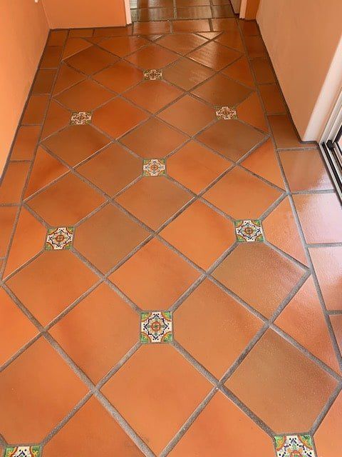 A Tiled Floor With a Geometric Pattern on It — The Tile & Stone Specialists in Peregian Beach, QLD