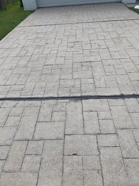 A Brick Driveway With a Drain in the Middle of It — The Tile & Stone Specialists in Peregian Beach, QLD