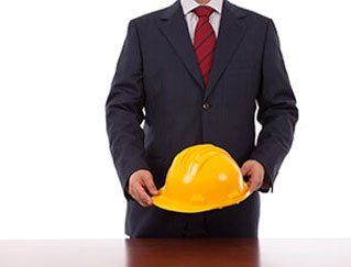Corporate man holding helmet — Commercial Insurance in Fort Walton Beach, FL