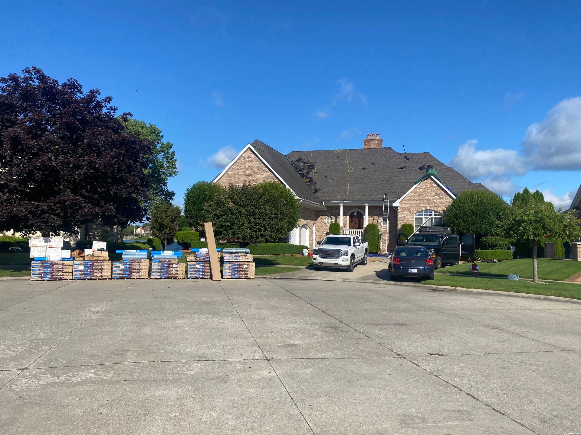 A large house with a lot of boxes in front of it.