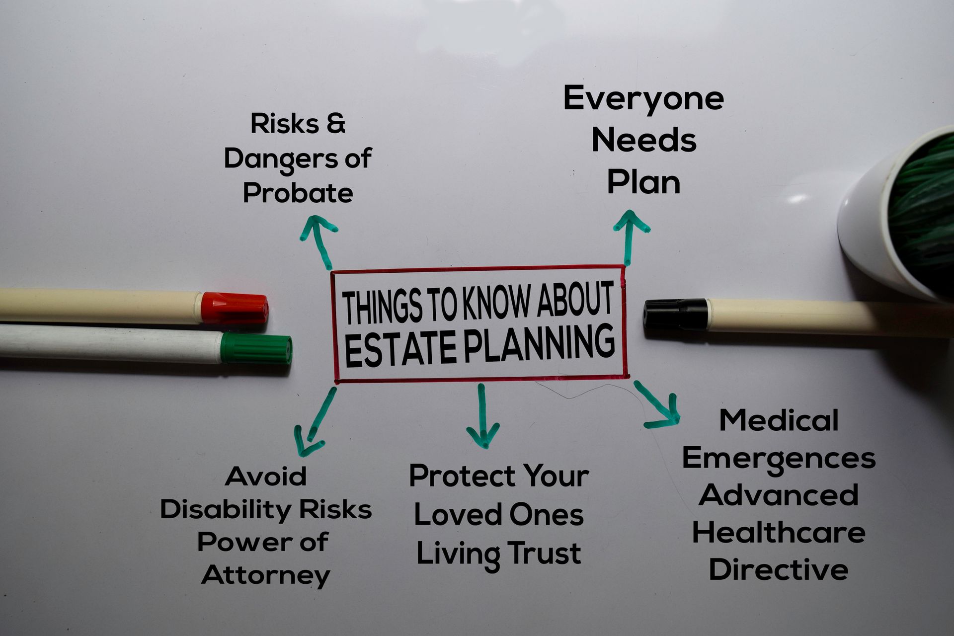 A row of houses on a tropical island next to a body of water.